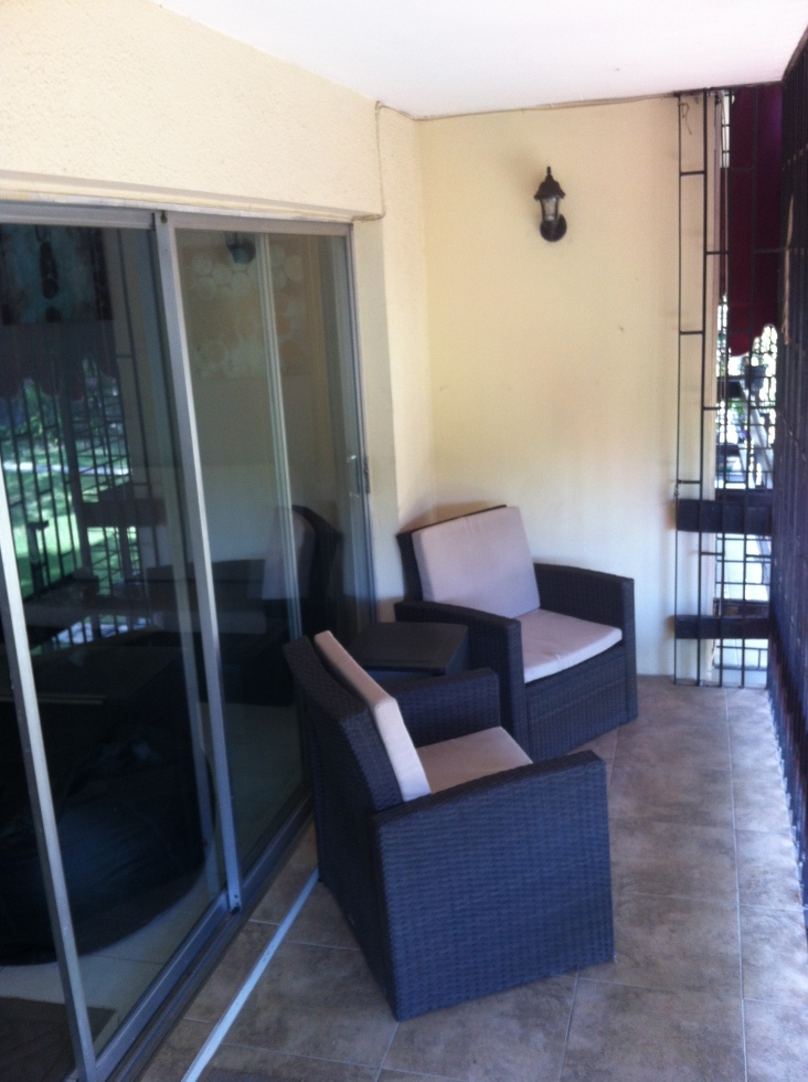 The rest of the patio set (though you can't see the fugly leather sofa leaning against the end wall)